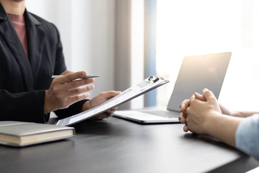 Clinical trial coordinator reviewing recruitment results